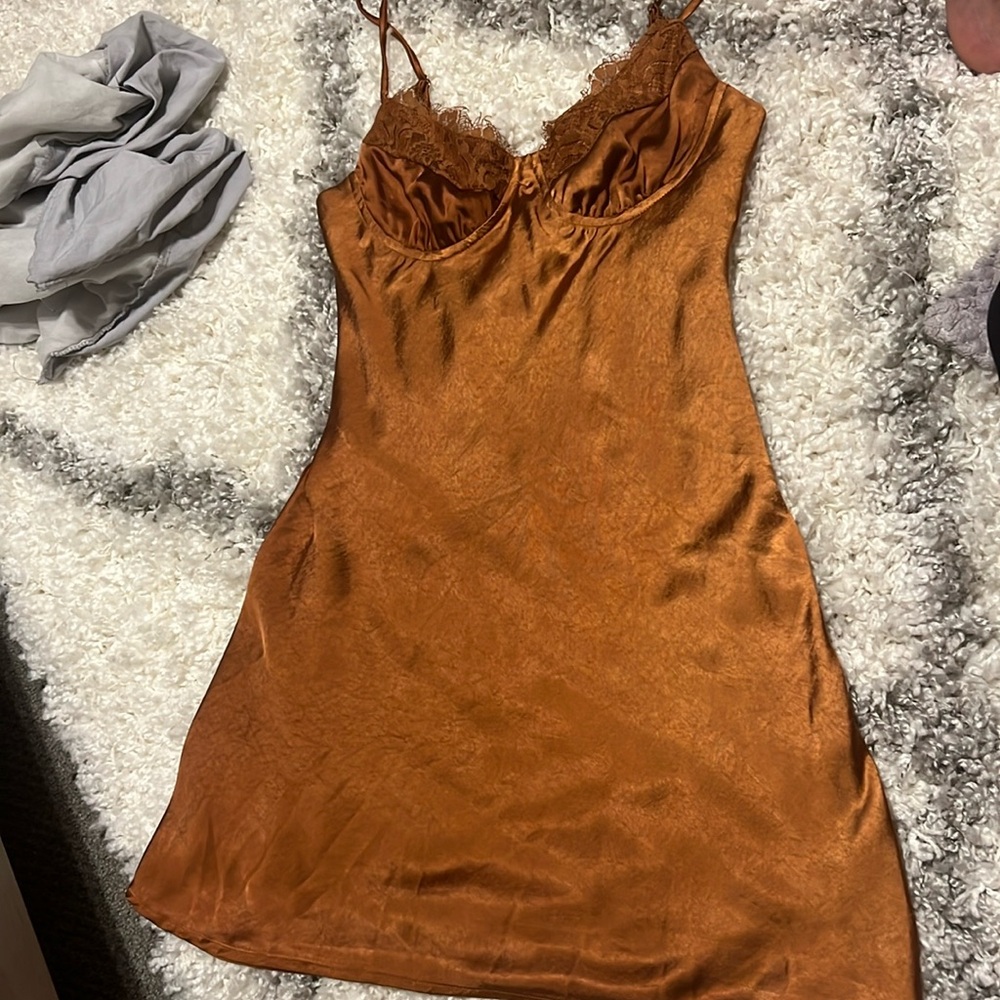 Rust orange satin dress.